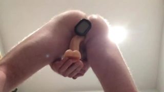 Sexy bald guy DP's his own ass with a butt plug and a dildo resulting in a huge comshot