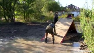 Lesbian babes get completely soaked in mud