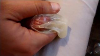 Masturbating and cumming in a condom 