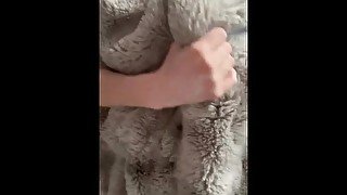 Guy masturbating with a thick faux fur blanket