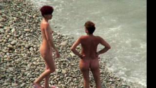 Nude girl picked up by voyeur cam at nude beach