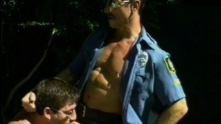 Two crooked cops order this submissive guy to blow them both off