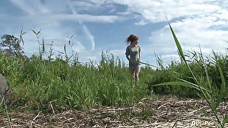 Lascivious petite redhead loves being outdoors and she has a pissing fetish