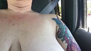 Chastity takes a Sunday drive topless