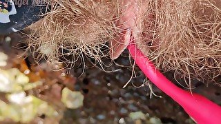 Hairy pussy with Lovense pissing in water