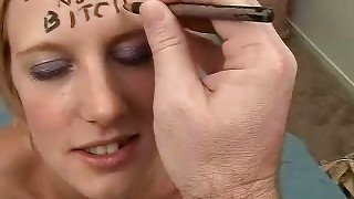 Disgraceful blondie with dirty words on her forehead blows dick