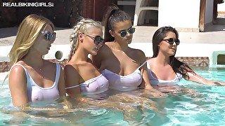 Four smoking hot chicks are sunbathing in wet white T-shirts