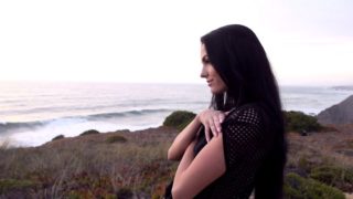 Long haired cutie displays her skinny twat on the beach