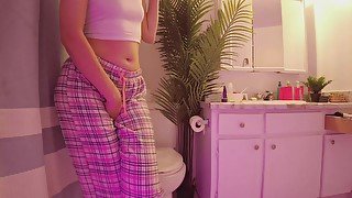 Emily pissing in the bathroom