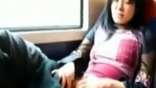 Asian milf rubs her clit on a train.