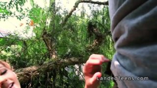 Teen with perfect body bangs in woods