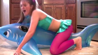 Horny slut grinds inflatable whale to orgasm