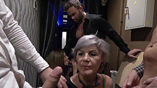 Dirty granny Ivana drops on her knees to share a dick with Izabela