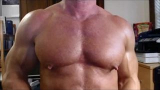 Jack Sargent plays with his beefy muscle pecs at JockMenLive.com