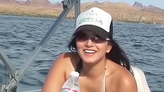 Naughty girls gets fucked outside during a huge lake party.