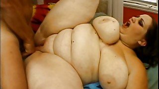 Super sized brunette plumper with big boobs enjoys big cock