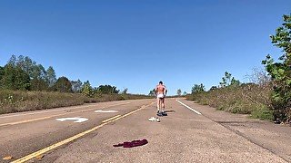 Stripping naked on a public road and jacking off before getting dressed again.