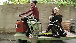 Two Latex Girls Bound And Gagged Outdoors