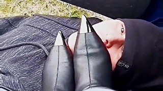 Leather boot licking in the car