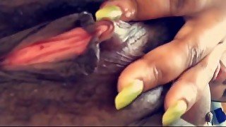 Ebony babe fingers juicy pussy