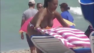 Plump breasted girl caught in a voyeur beach nudism video