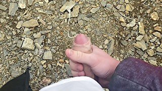 I jerk off a flaccid dick and cum on a mountain lake in nature! POV!