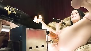 Brunette doesn't put aside vibrator during machine penetration