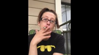 Nerdy Goddess D Smoking Cork Tip 100 Cigarette in Batman Shirt and Glasses