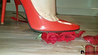 High heels crushing red rose