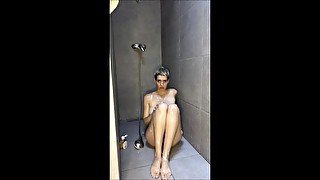 Shy girl in the shower puts soap on her pussy