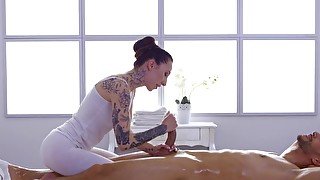 Guy covers masseuse's face with cum after sex