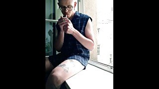 SHOWING OFF MY HARD COCK WHILE SMOKING IN THE WINDOW