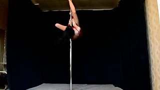 Pole dancing in a skimpy outfit close to the ceiling!