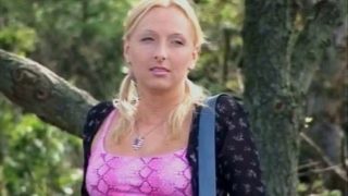 Hot blonde masturbates with a dildo outdoors