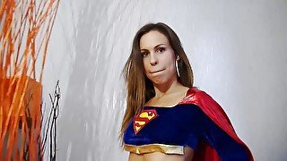 Beautiful babe in superman costume is dildoing her pussy