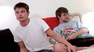 Bearded gay guy with glasses sucking his boyfriend's big cock