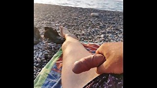 At the beach with a beautiful sea and my cock in the background