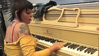 Talented sluts covered with tattoos have fun in the music studio