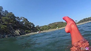 red stocking in the sea at the public beach