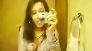 Cute chick self-shooting nude in the bathroom