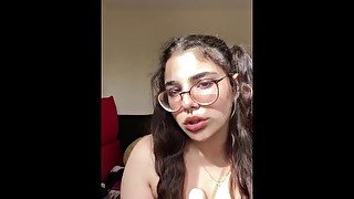 Cute girl in pigtails sucks her realistic dildo and salivates all over it