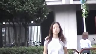 Curious long-haired Asian babe getting tricked during quick sharking action