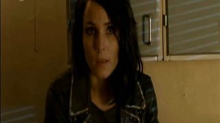 Noomi Rapace naked sitting on the edge of a bed, showing