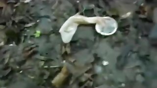 Crazy guy eats used condoms in the forest