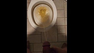 Messy piss fountain into the toilet