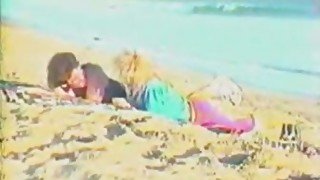 Slutty chick gets her twat licked and banged on a beach in retro vid