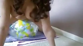 naked girl riding transparent earth beachball