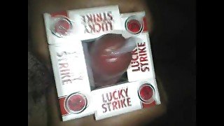 Stroking my cock with Lucky Strike packs