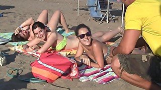 Spanish chicks seduced on a beach