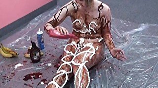 Horny bitch gets covered in whip cream and chocolate syrup